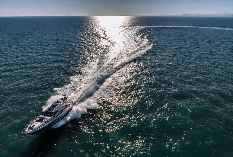 Yacht docking stern-to in a Mediterranean marina