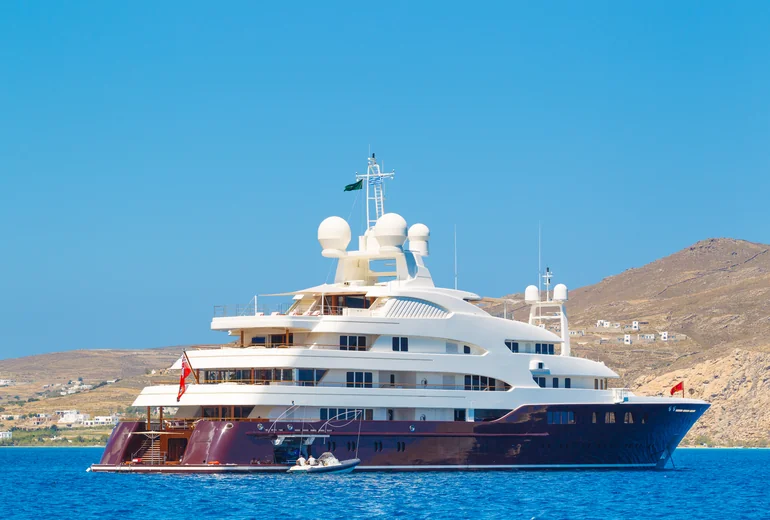 Yacht stern moored in town quay