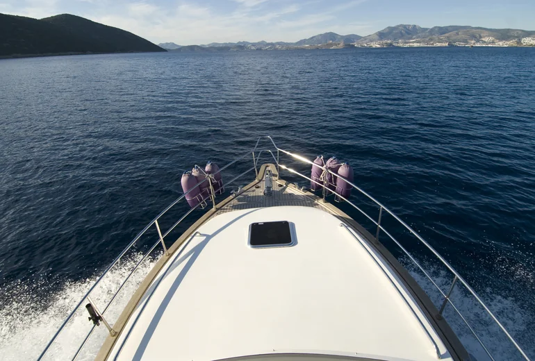 Catamaran at anchor in calm bay