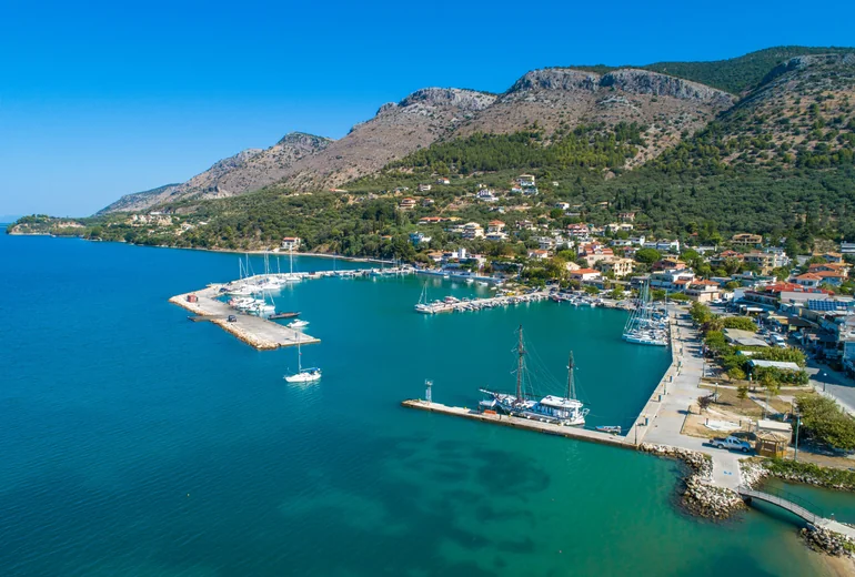 Drone view of a Greek coastline with sailing yachts