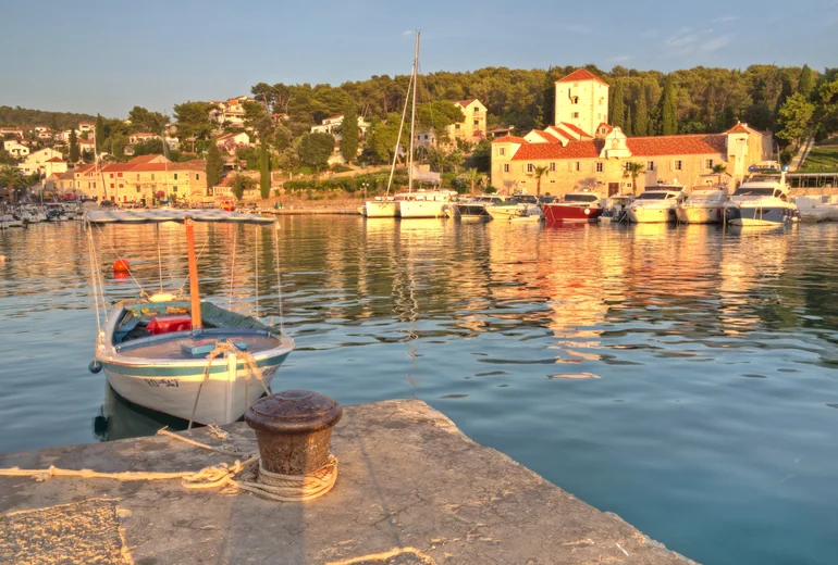 Brač island coastline with sailing yachts
