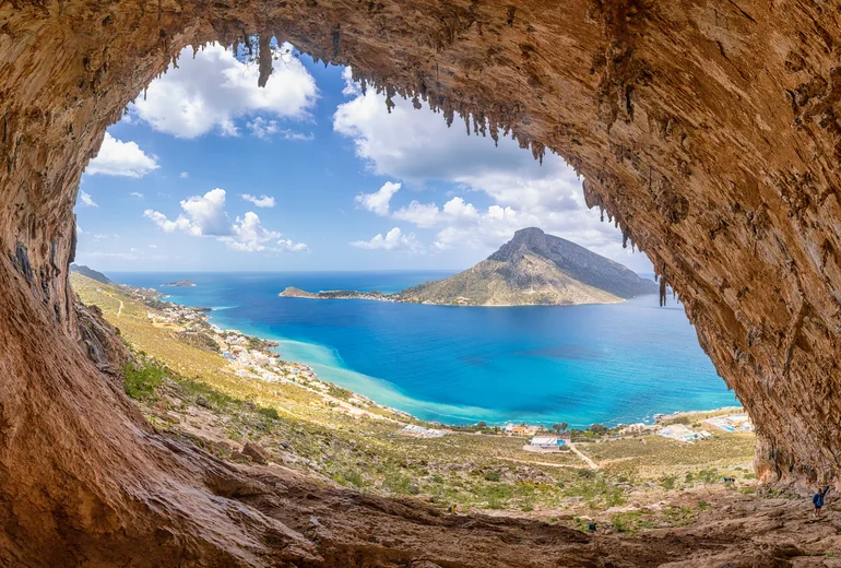 Greek island bay with traditional sailing boats